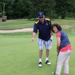 Coach Catlett gave putting advice to WVFL Program Director Mary Anne Buchanan in 2015.